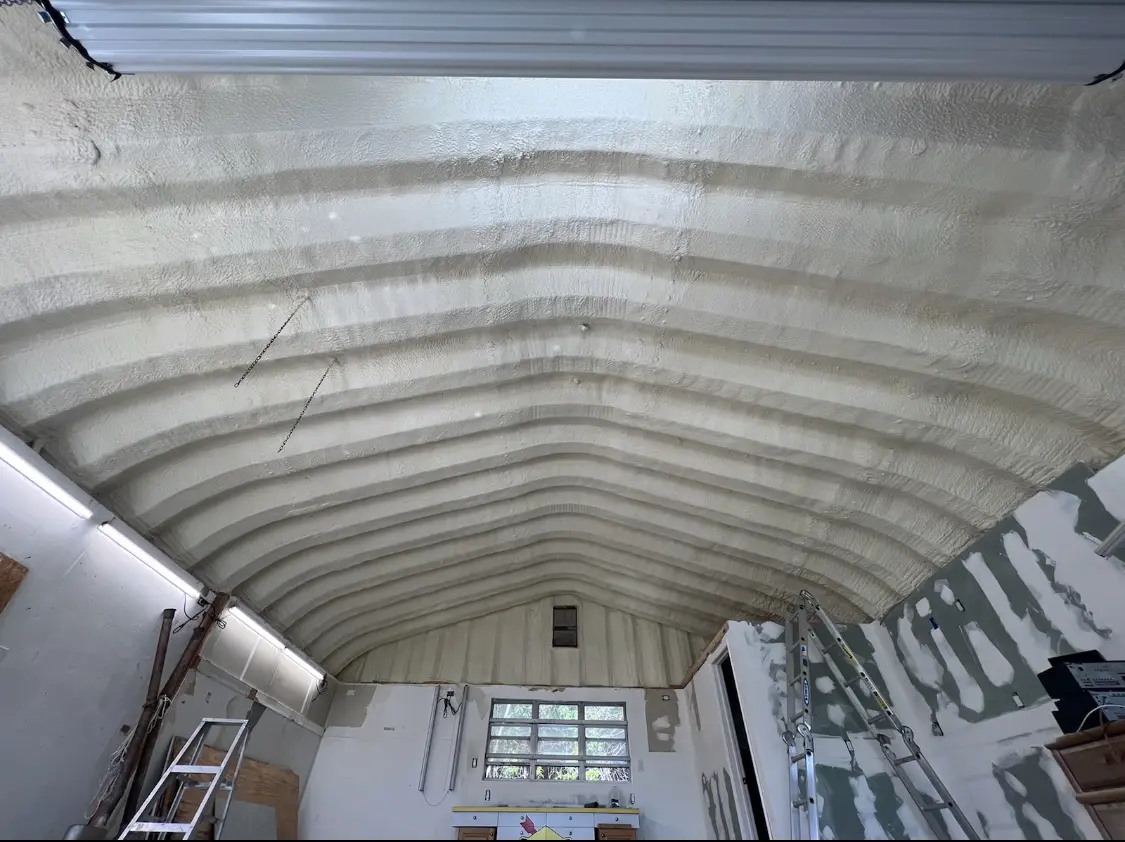 Spray polyurethane foam applied to the underside of a metal roof deck in Holtville